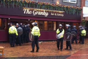 Riot police outside the Granby pub in Nuneaton