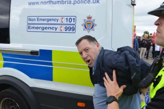 Thomas Allen being led away by police during the demos in Sunderland