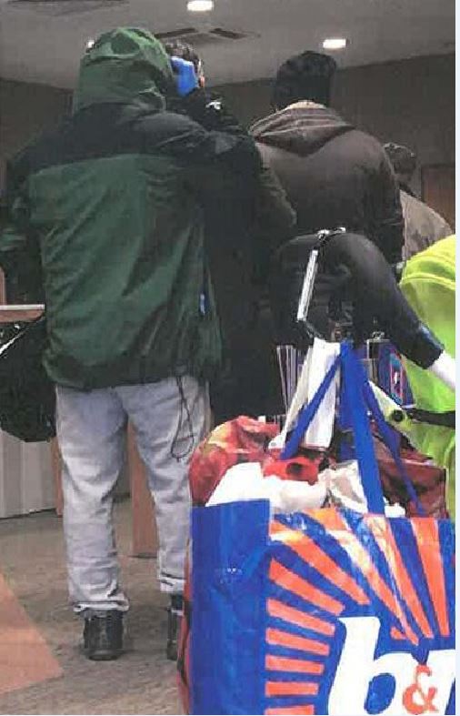 Simon Jones, 38, queued behind other customers in Bishop Auckland for 15 minutes wearing blue latex gloves, a hooded top pulled up, a face mask and dark glasses. He was also carrying a bottle of Febreze and a hold-all